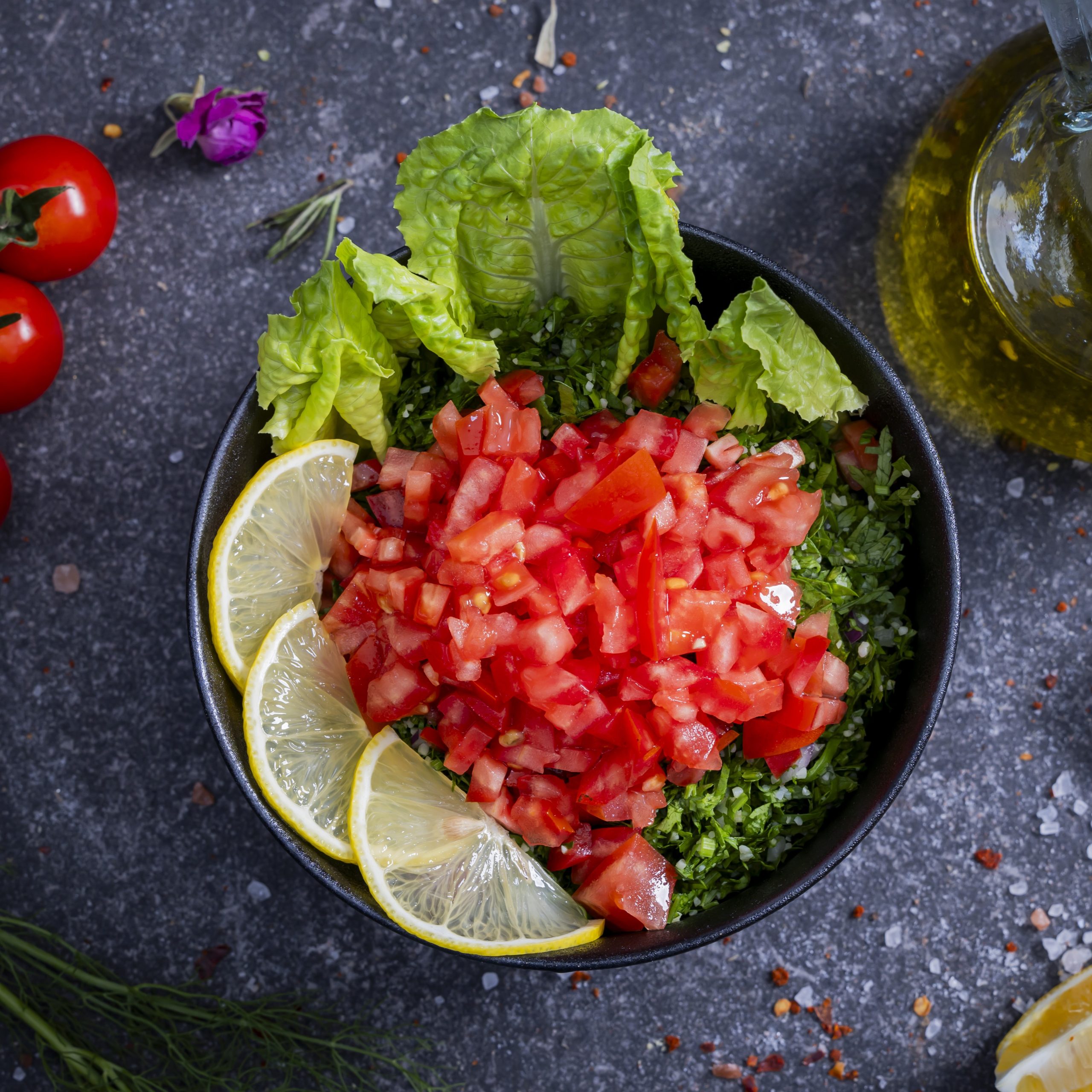Taboleh - <p>Fresh salad made from finely chopped parsley, mint, tomatoes, bulgur wheat, lemon juice, and olive oil.</p>